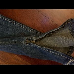 Skinny jeans with red/white effects and zippers